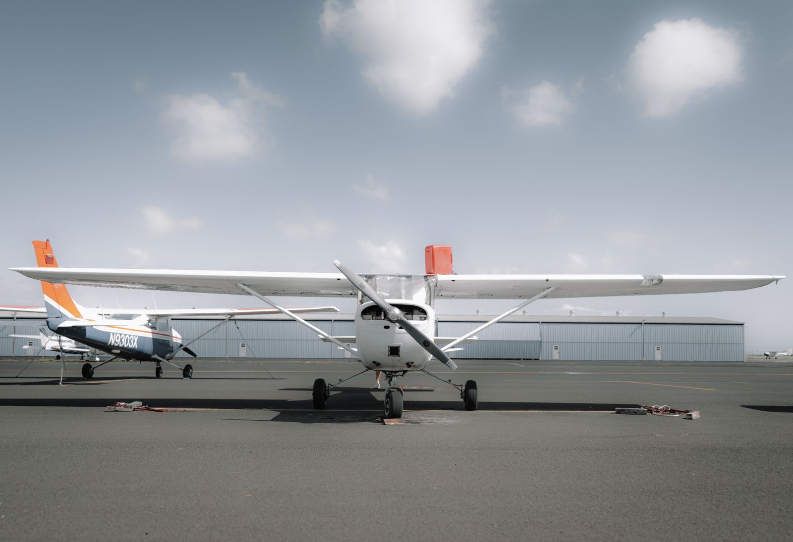 High-wing aeroplane parked in the sun